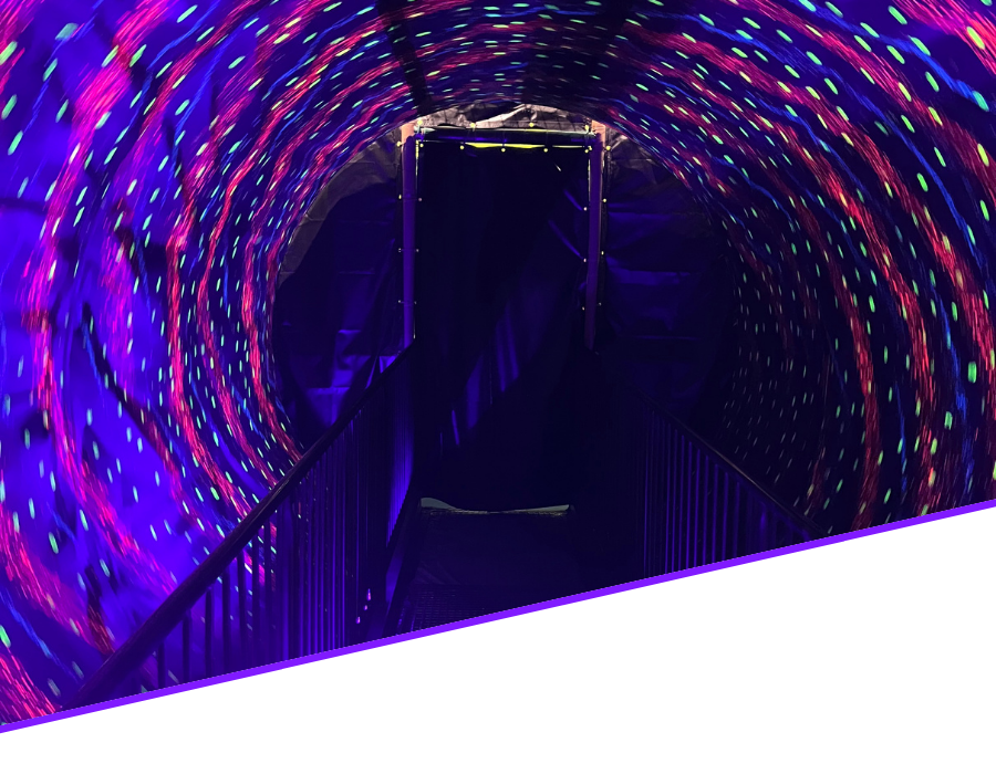6 Child happily enjoying a harnessed indoor trampoline bungee experience, bouncing safely in an adventure-themed play area.